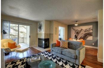 Living Room with Fireplace Hardwood Inspired Floors and Private Patio at Folsom Ranch, Folsom